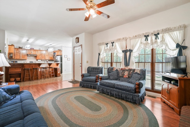 8661 Laurel Grove Ln, North Charleston, SC 29420 - living room with visible vents, ceiling fan, and wood finished floors