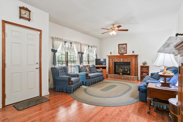 8661 Laurel Grove Ln, North Charleston, SC 29420 - living area featuring a brick fireplace, ceiling fan, and wood finished floors