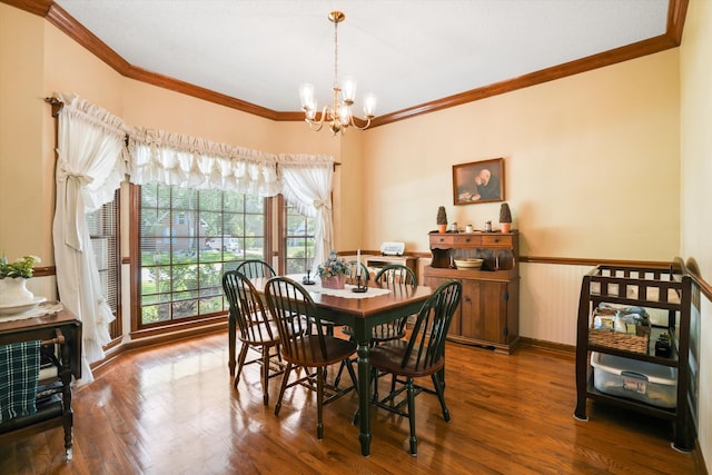8661 Laurel Grove Ln, North Charleston, SC 29420 - dining space with crown molding, a chandelier, wood finished floors, and a wainscoted wall