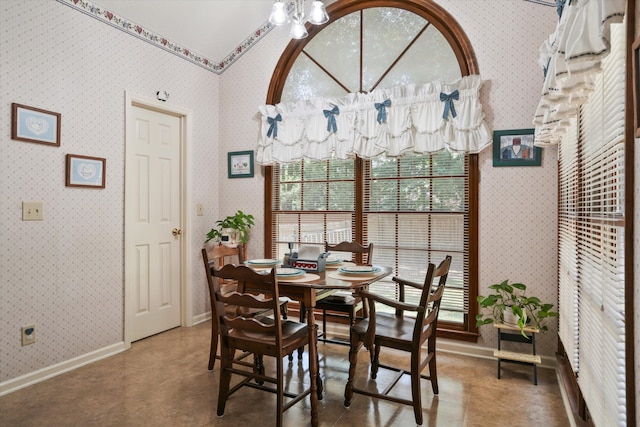 8661 Laurel Grove Ln, North Charleston, SC 29420 - dining room featuring baseboards, wallpapered walls, and a notable chandelier