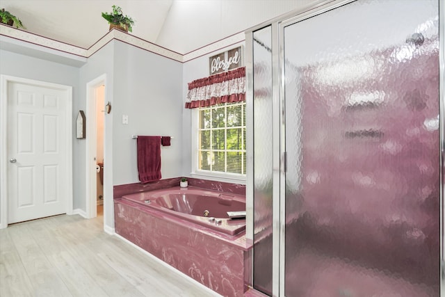 8661 Laurel Grove Ln, North Charleston, SC 29420 - full bathroom with a jetted tub, baseboards, a shower stall, and wood finished floors