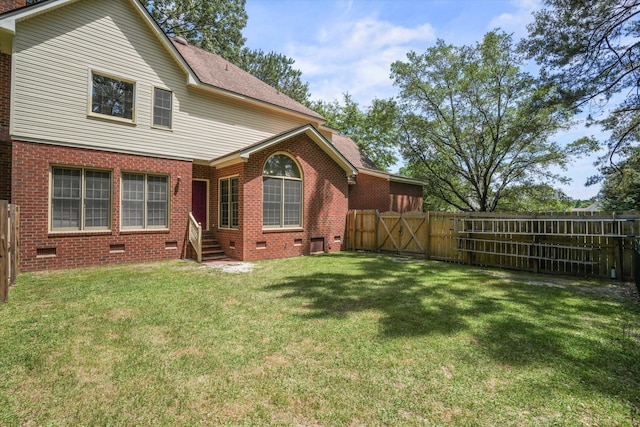 8661 Laurel Grove Ln, North Charleston, SC 29420 - back of house featuring crawl space, a gate, brick siding, a fenced backyard, and entry steps