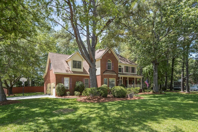 8661 Laurel Grove Ln, North Charleston, SC 29420 - view of front facade featuring a garage, fence, a front yard, and brick siding