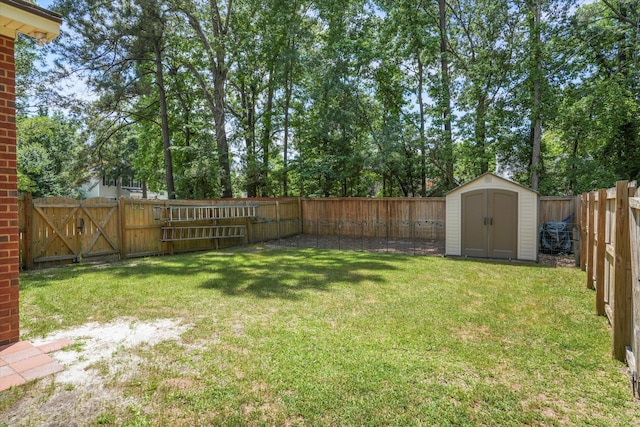 8661 Laurel Grove Ln, North Charleston, SC 29420 - view of yard with a fenced backyard, a storage unit, an outbuilding, and a gate