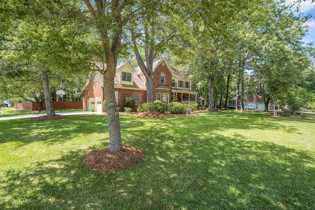 8661 Laurel Grove Ln, North Charleston, SC 29420 - traditional home with driveway, a front lawn, and a garage
