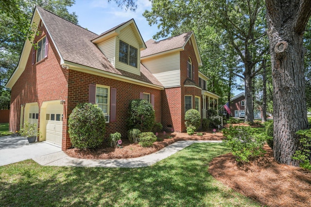 8661 Laurel Grove Ln, North Charleston, SC 29420 - view of front of house featuring concrete driveway, brick siding, roof with shingles, and a garage