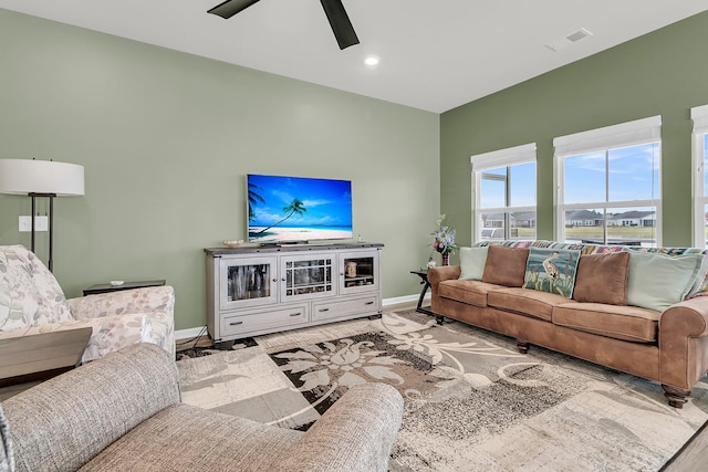 living area featuring ceiling fan, baseboards, wood finished floors, and recessed lighting