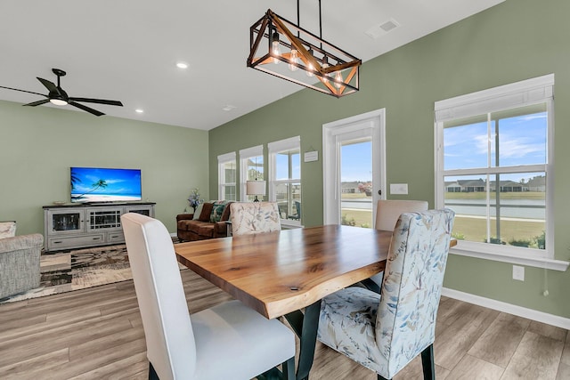 dining space featuring wood finished floors, plenty of natural light, recessed lighting, a ceiling fan, and baseboards