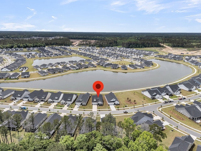 view of property location featuring nearby suburban area and a nearby body of water