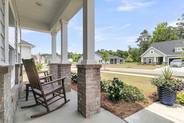 view of patio / terrace featuring covered porch and a residential view
