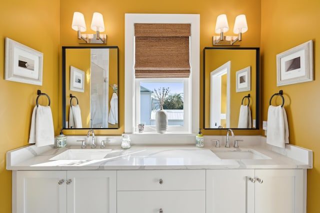 bathroom with vanity and an inviting chandelier