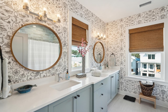 bathroom featuring tile patterned floors, plenty of natural light, vanity, and a shower with shower curtain