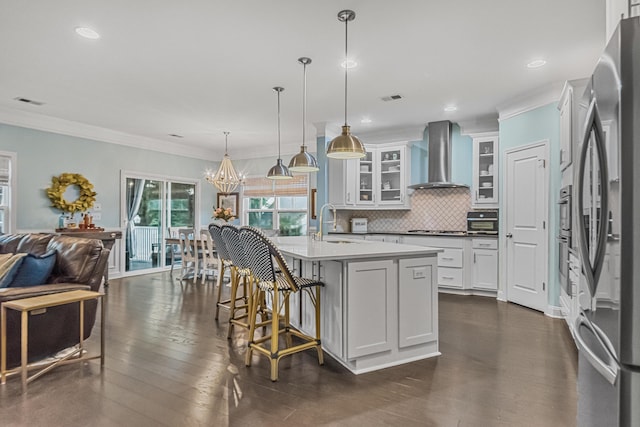 307 Morning Marsh Ln, Charleston, SC 29492 - kitchen featuring wall chimney exhaust hood, freestanding refrigerator, crown molding, decorative backsplash, and open floor plan