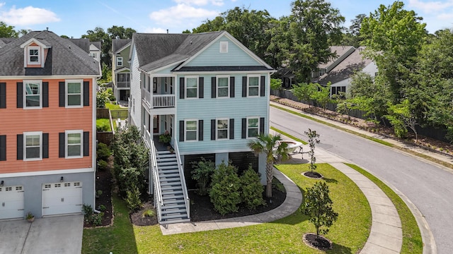 307 Morning Marsh Ln, Charleston, SC 29492 - view of front of property featuring stairs, a garage, concrete driveway, a residential view, and a front lawn