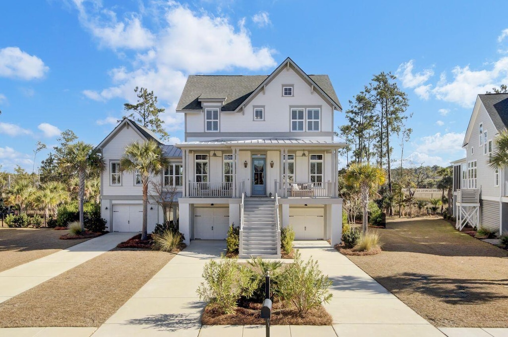 view of front facade with covered porch and a garage