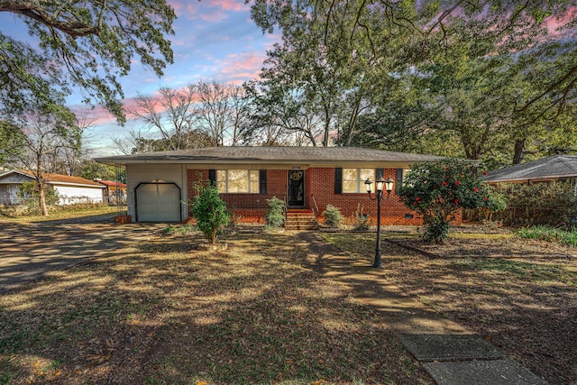 ranch-style home featuring a garage