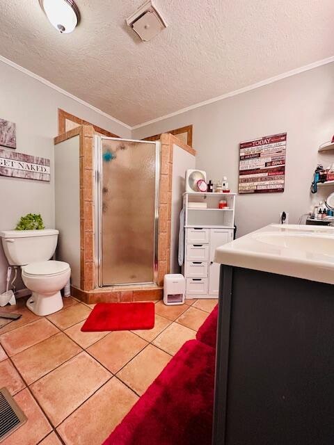 bathroom featuring toilet, a shower with door, crown molding, and vanity