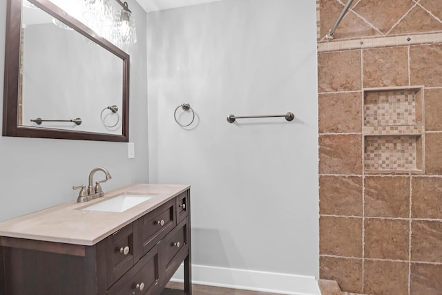 bathroom featuring vanity and baseboards