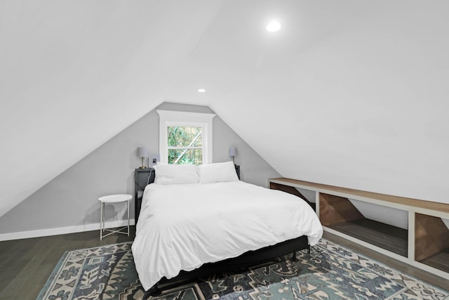 bedroom with recessed lighting, baseboards, wood finished floors, and vaulted ceiling