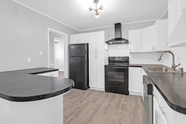 kitchen with black appliances, ornamental molding, a sink, dark countertops, and wall chimney range hood