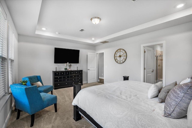 bedroom with a raised ceiling, carpet flooring, recessed lighting, and visible vents