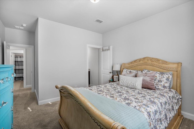 bedroom with carpet, visible vents, and baseboards