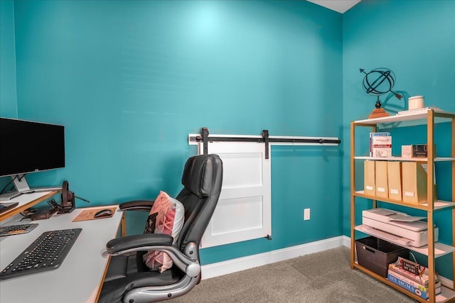 carpeted office space featuring baseboards