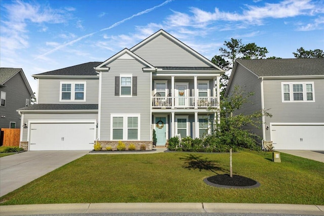 view of front of house featuring a garage, a balcony, concrete driveway, and a front lawn