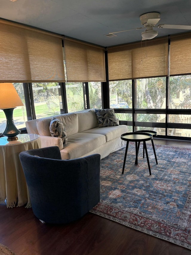 sunroom featuring ceiling fan