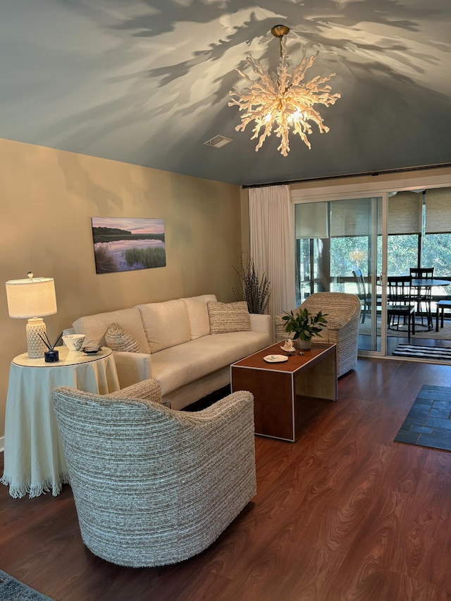 living room featuring dark hardwood / wood-style flooring and a notable chandelier