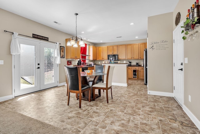 dining space with visible vents, baseboards, recessed lighting, french doors, and a notable chandelier