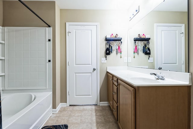 bathroom featuring vanity, bathing tub / shower combination, baseboards, and tile patterned floors