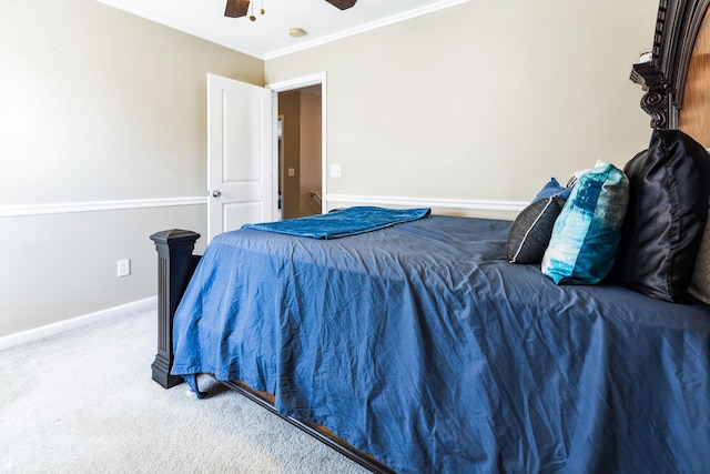 bedroom featuring carpet flooring, ceiling fan, baseboards, and ornamental molding