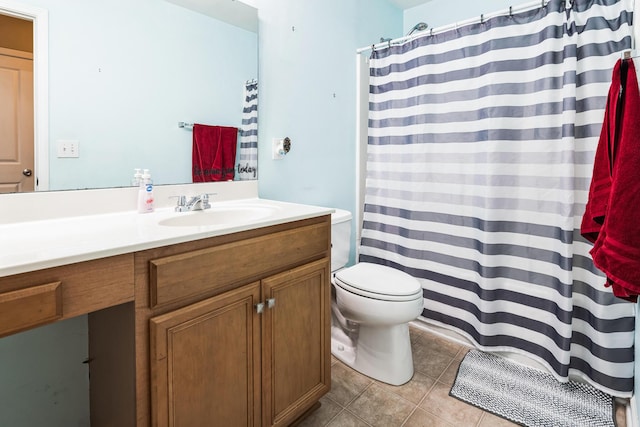 bathroom featuring tile patterned flooring, toilet, curtained shower, and vanity