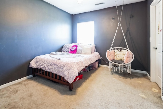 bedroom with visible vents, carpet flooring, and baseboards