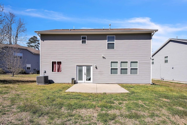 back of property featuring a yard, a patio, and cooling unit