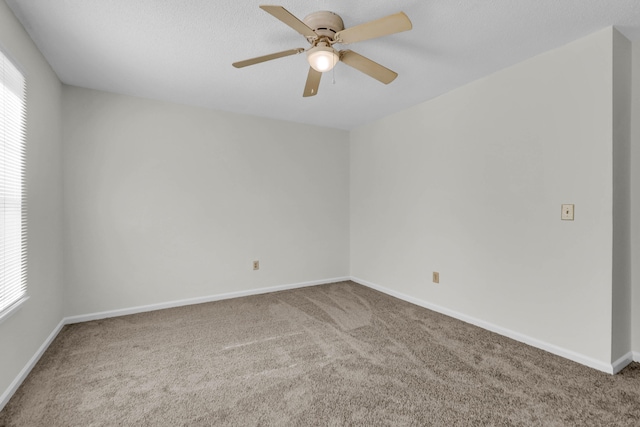 unfurnished room with carpet floors and ceiling fan