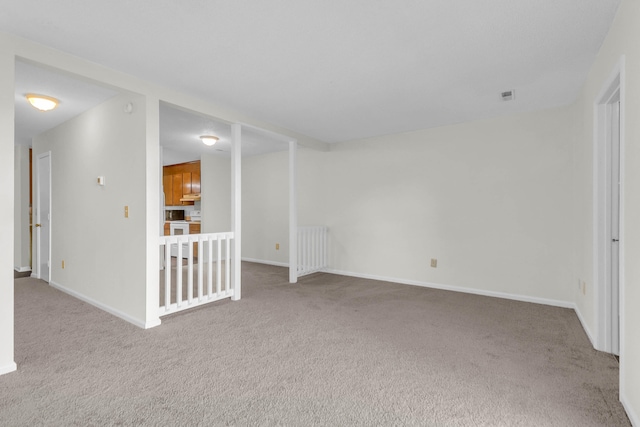 carpeted spare room with radiator heating unit