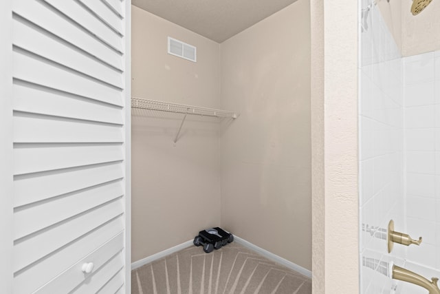 laundry area featuring carpet