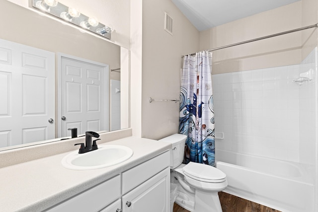 full bathroom featuring vanity, hardwood / wood-style flooring, toilet, and shower / bathtub combination with curtain