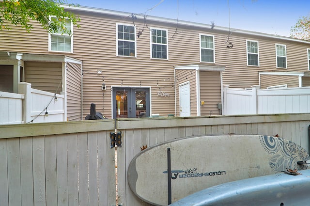 rear view of house featuring french doors