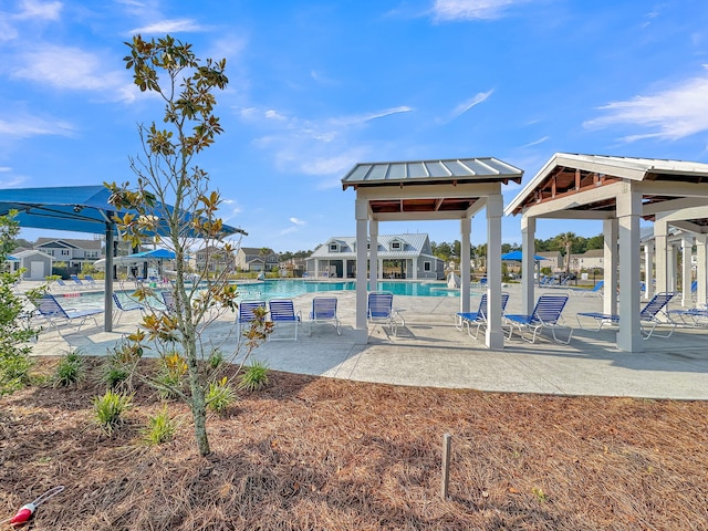 view of home's community with a pool, a patio, and a gazebo