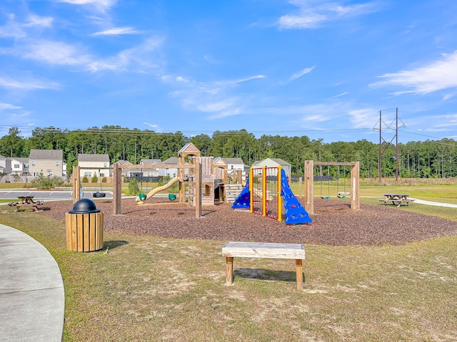 communal playground featuring a lawn