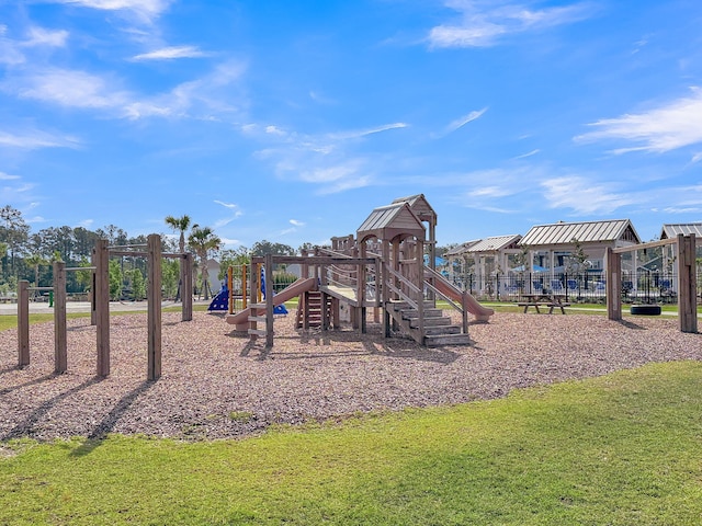 communal playground featuring a yard