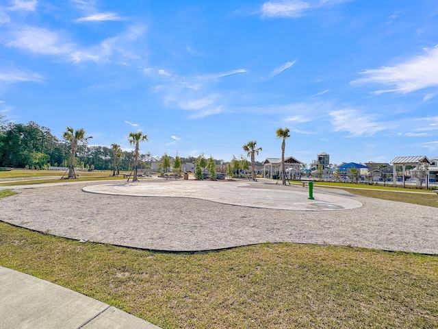 view of property's community with a lawn