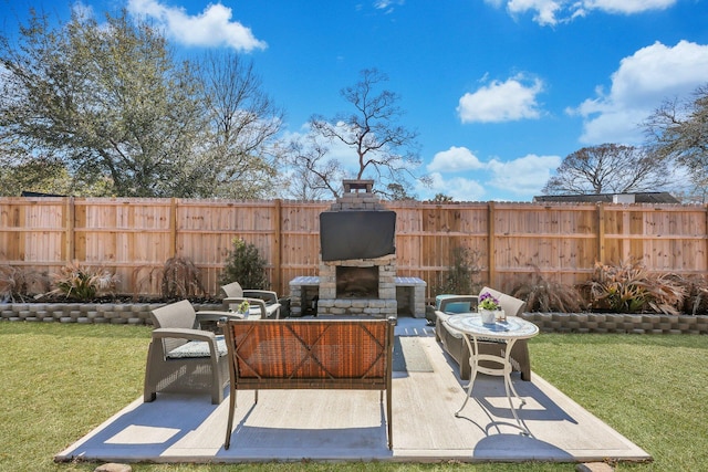 view of patio / terrace featuring an outdoor living space with a fireplace and fence