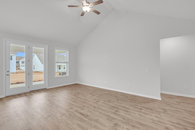 spare room featuring high vaulted ceiling, ceiling fan, and light hardwood / wood-style flooring