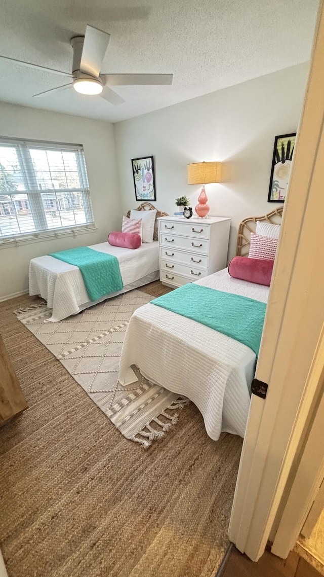 519 Parkdale Dr Unit J, Charleston, SC 29414 - bedroom with ceiling fan and a textured ceiling