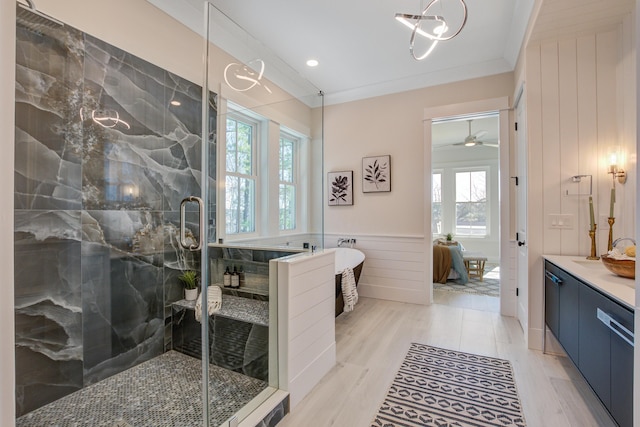 bathroom with vanity, hardwood / wood-style floors, crown molding, and independent shower and bath