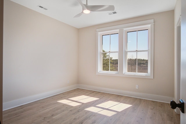 spare room with ceiling fan and light hardwood / wood-style floors